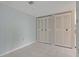 Bedroom with double closets and light-blue walls at 660 Island Way # 301, Clearwater Beach, FL 33767