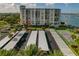 Condo building showcasing parking and water views at 660 Island Way # 301, Clearwater Beach, FL 33767