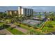Aerial view showing tennis courts and building at 660 Island Way # 301, Clearwater Beach, FL 33767