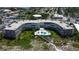 Aerial view of condo building with pool and beach access at 4450 Gulf Blvd # 104, St Pete Beach, FL 33706