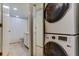 Convenient laundry room with a stackable washer and dryer at 4450 Gulf Blvd # 104, St Pete Beach, FL 33706