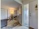 Bright entryway with glass door and view of living room at 4450 Gulf Blvd # 104, St Pete Beach, FL 33706