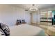 Bedroom with mirrored closet doors and a comfortable bed at 4450 Gulf Blvd # 104, St Pete Beach, FL 33706