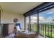 Balcony with stunning ocean views and comfy seating at 4450 Gulf Blvd # 104, St Pete Beach, FL 33706