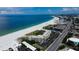 Aerial of beachfront property; ocean, beach, and building at 4450 Gulf Blvd # 104, St Pete Beach, FL 33706