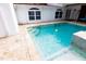 Clean lines and refreshing blue water highlight this inviting pool and spa at 5501 Bates St, Seminole, FL 33772