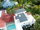 Aerial view highlighting solar panels on the roof and a pool at 5501 Bates St, Seminole, FL 33772