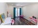 Charming bedroom with French doors, hardwood floors, and a playful atmosphere at 5501 Bates St, Seminole, FL 33772