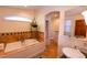 Spa-like bathroom with soaking tub, walk-in shower, and updated fixtures at 5501 Bates St, Seminole, FL 33772