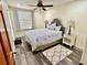 Charming bedroom featuring a bunk bed, hardwood floors, and coral curtains at 5501 Bates St, Seminole, FL 33772