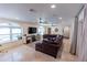 Relaxing living room with large sectional sofa and tile floors at 5501 Bates St, Seminole, FL 33772