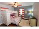 Cozy bedroom with a bunk bed, hardwood floors, and coral curtains at 5501 Bates St, Seminole, FL 33772