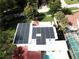 Aerial view of house showcasing solar panels and a pool at 5501 Bates St, Seminole, FL 33772