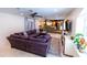 Open concept living room with a view into the kitchen and backyard at 5501 Bates St, Seminole, FL 33772