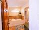 Elegant bathroom with a soaking tub, tile flooring, and decorative plants at 5501 Bates St, Seminole, FL 33772