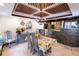 Open concept dining room with stone accent wall and adjacent kitchen at 5501 Bates St, Seminole, FL 33772