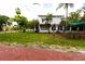 Side view of the house showing the backyard and a red brick walkway at 5501 Bates St, Seminole, FL 33772