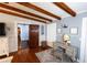 Main bedroom with hardwood floors, exposed beams, and a vanity area at 5501 Bates St, Seminole, FL 33772