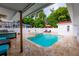 Inviting pool area with a large pool, spa, and patio furniture at 5501 Bates St, Seminole, FL 33772