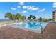 Outdoor swimming pool with brick trim, surrounded by lounge chairs and palm trees overlooking the beach at 11000 Gulf Blvd # 301, Treasure Island, FL 33706