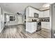 Modern kitchen with white cabinets and stainless steel appliances at 8996 Southern Comfort, Largo, FL 33773