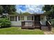 Small house with wooden steps and porch at 2805 58Th N Pl, St Petersburg, FL 33714