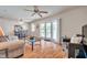 Spacious living room with glass doors leading to a private balcony at 5157 Beach Se Dr # C, St Petersburg, FL 33705