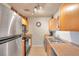 Bright kitchen with stainless steel appliances and light wood cabinets at 5157 Beach Se Dr # C, St Petersburg, FL 33705