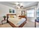Bedroom with a wooden bed frame and tropical decor at 5157 Beach Se Dr # C, St Petersburg, FL 33705