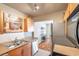 Kitchen features stainless steel appliances and an open view to the dining area at 5157 Beach Se Dr # C, St Petersburg, FL 33705
