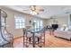 Charming dining area with a glass-top table and four chairs at 5157 Beach Se Dr # C, St Petersburg, FL 33705