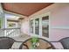 Covered balcony with seating area and water views at 5157 Beach Se Dr # C, St Petersburg, FL 33705