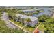 Aerial view of pink building near waterfront with parking at 5157 Beach Se Dr # C, St Petersburg, FL 33705