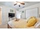 Bright bedroom with a comfortable bed, TV and closet at 5157 Beach Se Dr # C, St Petersburg, FL 33705