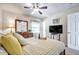 Bedroom with a wooden bed frame, ceiling fan and a TV at 5157 Beach Se Dr # C, St Petersburg, FL 33705