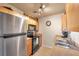 Bright kitchen with stainless steel appliances and light wood cabinets at 5157 Beach Se Dr # C, St Petersburg, FL 33705