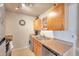 Modern kitchen with stainless steel appliances and light wood cabinets at 5157 Beach Se Dr # C, St Petersburg, FL 33705
