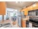 Kitchen features stainless steel appliances and an open view to the dining area at 5157 Beach Se Dr # C, St Petersburg, FL 33705