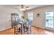 Bright dining area with water views and access to a private deck at 5157 Beach Se Dr # C, St Petersburg, FL 33705