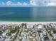 Aerial view showing the condo's location near the beach and other homes at 403 Gulf Way # 302, St Pete Beach, FL 33706