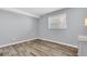 Simple bedroom with light grey walls and wood flooring at 403 Gulf Way # 302, St Pete Beach, FL 33706