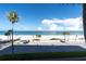 Scenic beachfront view with palm trees and ocean at 403 Gulf Way # 302, St Pete Beach, FL 33706