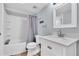 Clean bathroom with tub shower combo and white vanity at 403 Gulf Way # 302, St Pete Beach, FL 33706