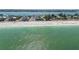 Aerial view of beachfront property showcasing its location and proximity to the ocean at 403 Gulf Way # 302, St Pete Beach, FL 33706
