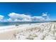 Expansive beach with white sand and blue water at 403 Gulf Way # 302, St Pete Beach, FL 33706