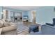 Living room with ocean view and access to balcony at 403 Gulf Way # 302, St Pete Beach, FL 33706
