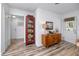 Entryway with decorative hutch, wooden console table, artwork, and access to another room at 1049 Marine St, Clearwater, FL 33755