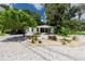 Inviting front yard with white rock landscaping and green plants at 1049 Marine St, Clearwater, FL 33755