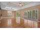 Spacious living room with hardwood floors and sliding glass doors leading to a balcony at 7545 Gulf Way, Hudson, FL 34667