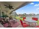 Relaxing patio overlooking the water with seating area at 400 Larboard Way # 106, Clearwater Beach, FL 33767